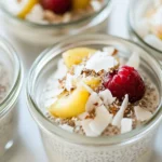 Coconut chia pudding topped with berries and coconut on a breakfast table