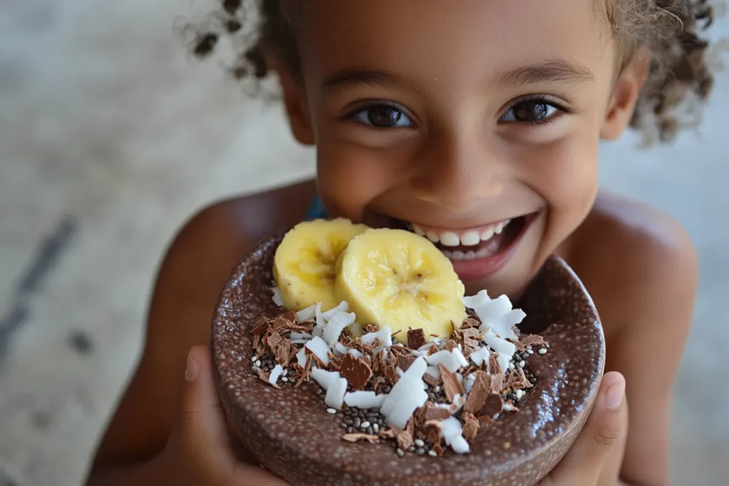 Happy child enjoying coconut chia pudding at the table